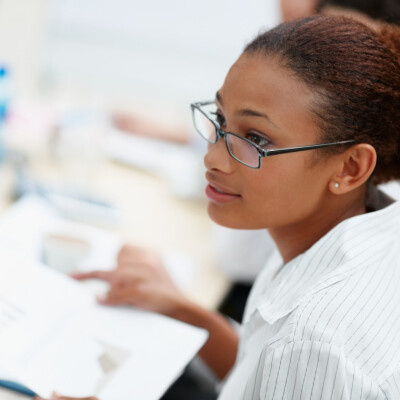 Young African American business woman with spectacles while at work; Shutterstock ID 46793209; PO: The Huffington Post; Job: The Huffington Post; Client: The Huffington Post; Other: The Huffington Post